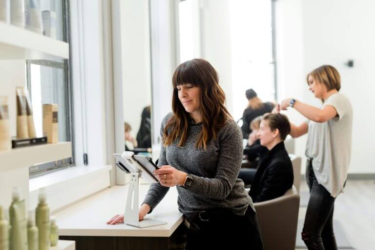 Hairdressers working in a salon